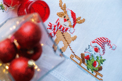 Embroidered tablecloth with gnome and reindeer motifs