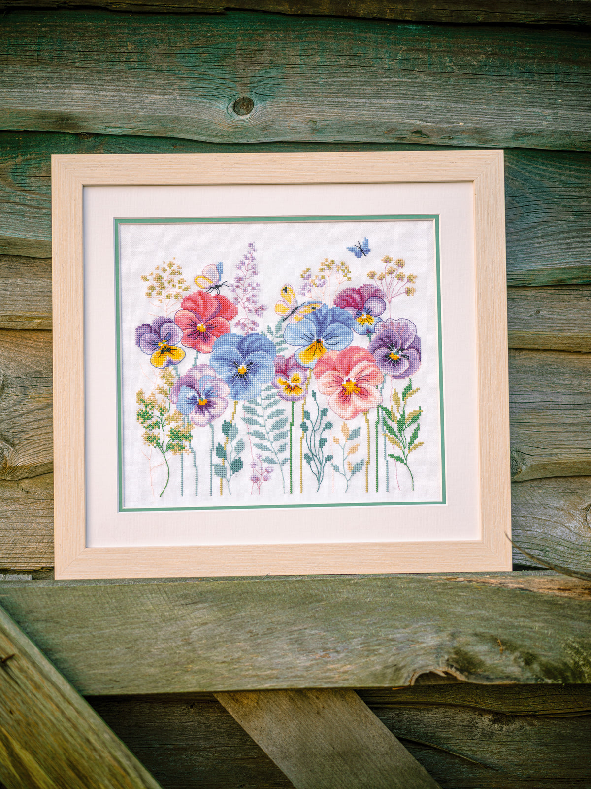 Cross stitch of pansies and grasses