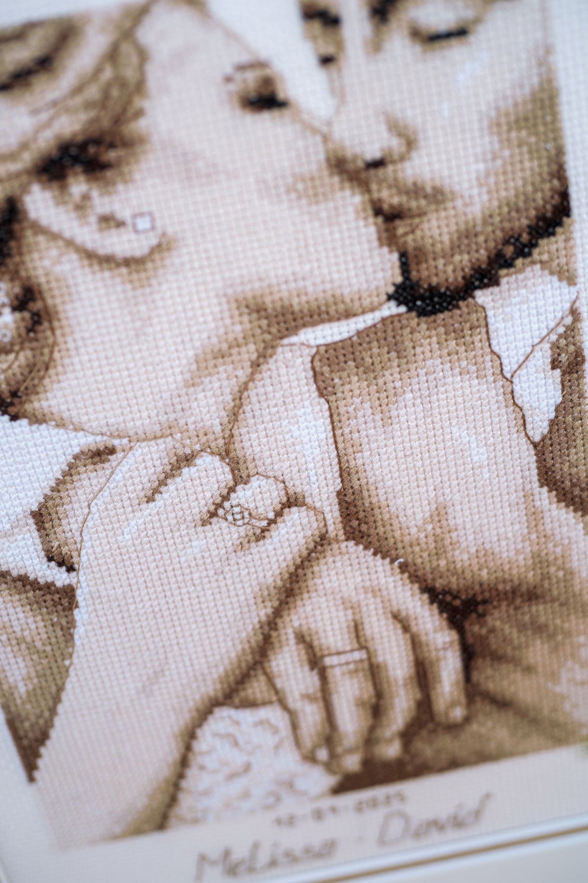Cross stitch of a loving kiss