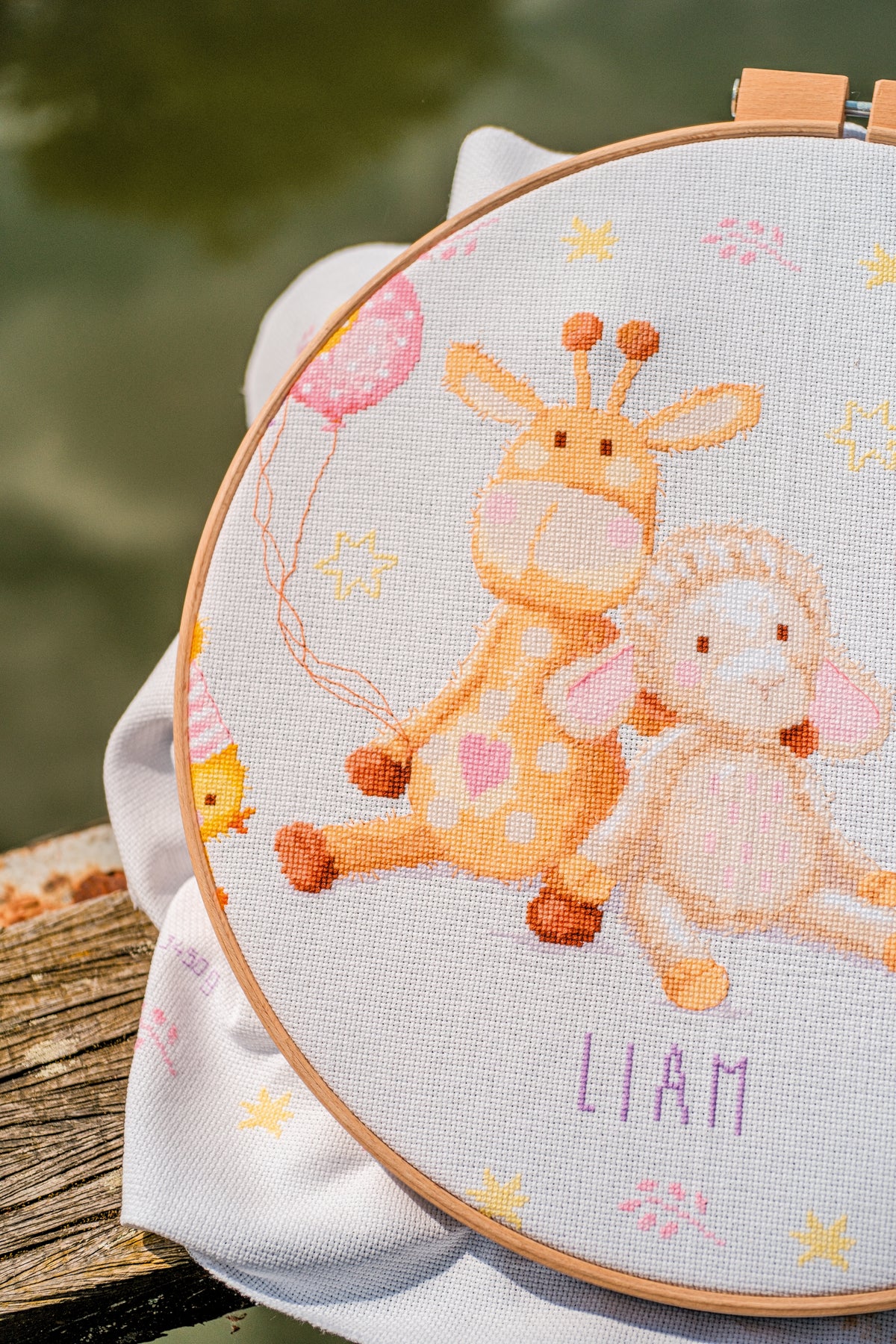 Cross stitched birth record with party animals
