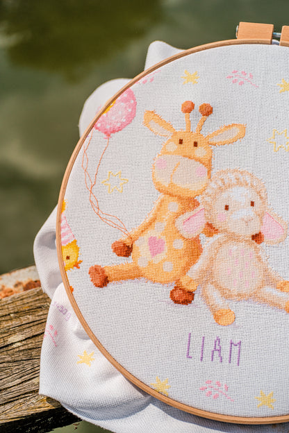 Cross stitched birth record with party animals