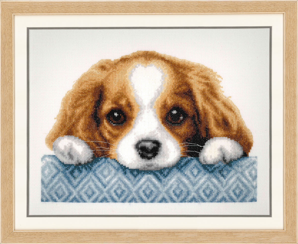 Cross stitch picture of a puppy