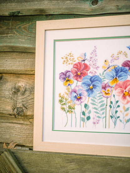 Cross stitch picture of pansies and grasses
