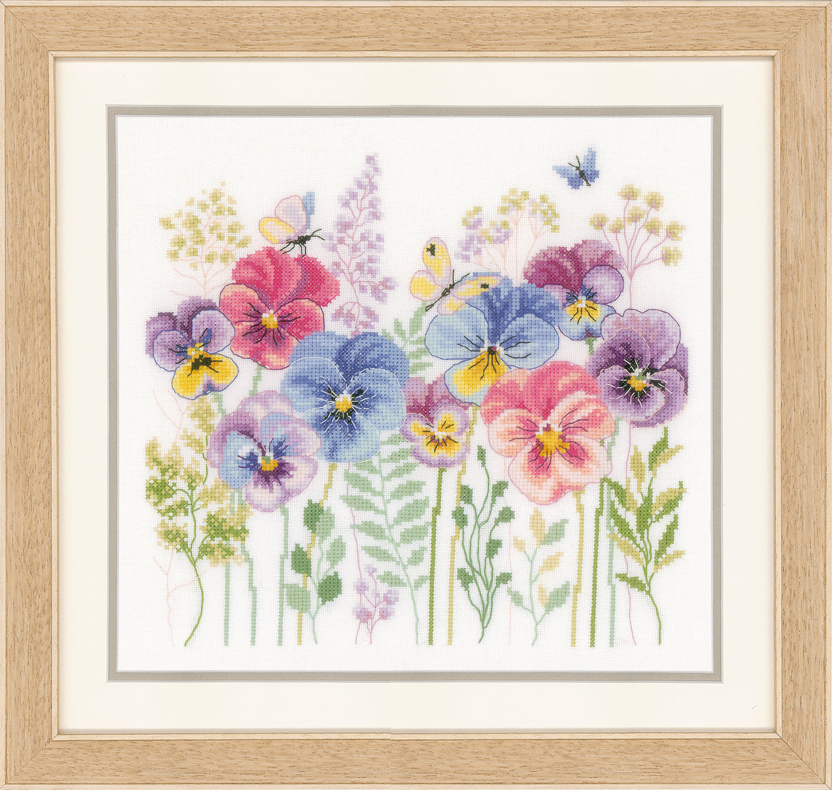 Cross stitch picture of pansies and grasses