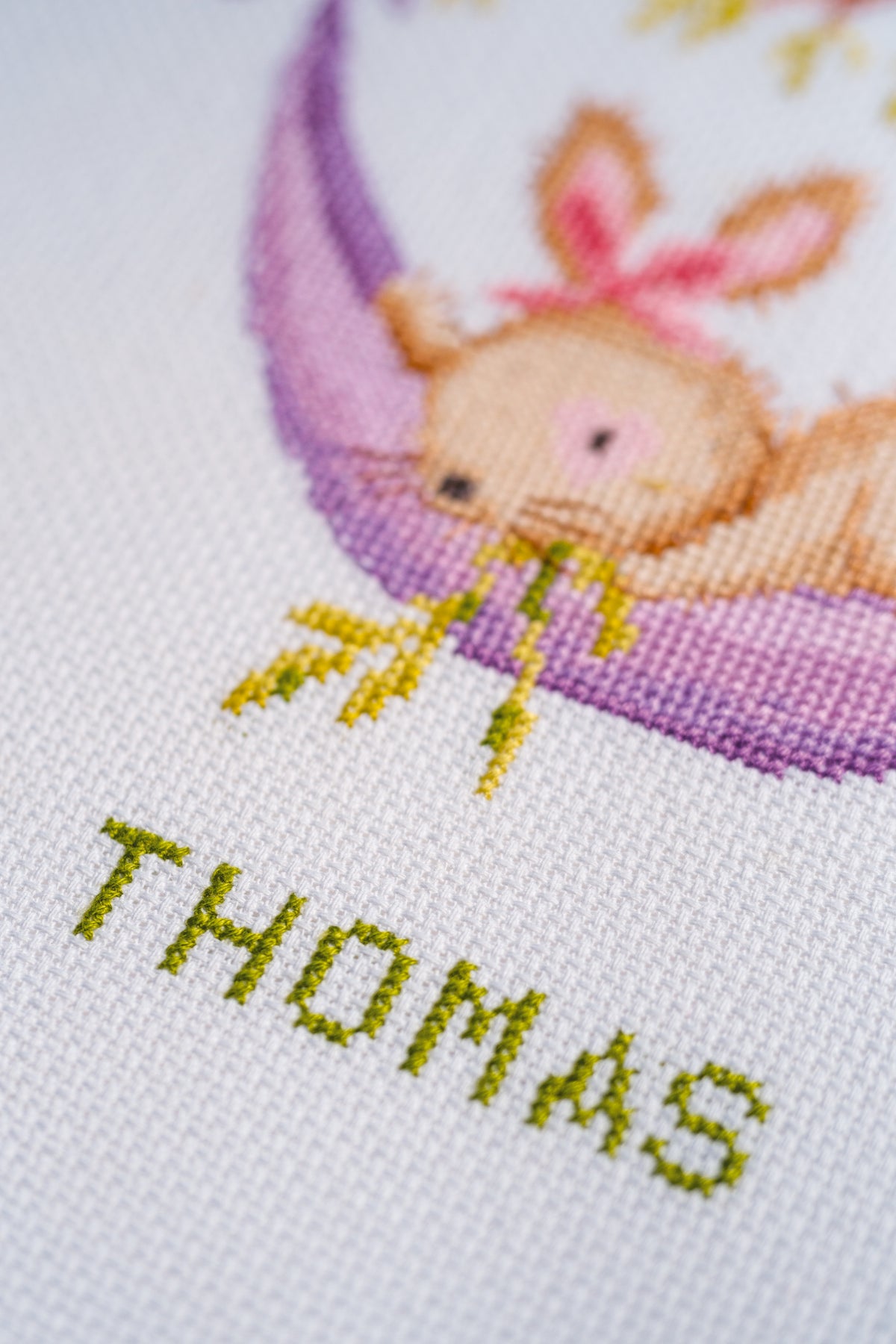 Vervaco Bunnies in the Garden counted cross stitch kit showing the finished design