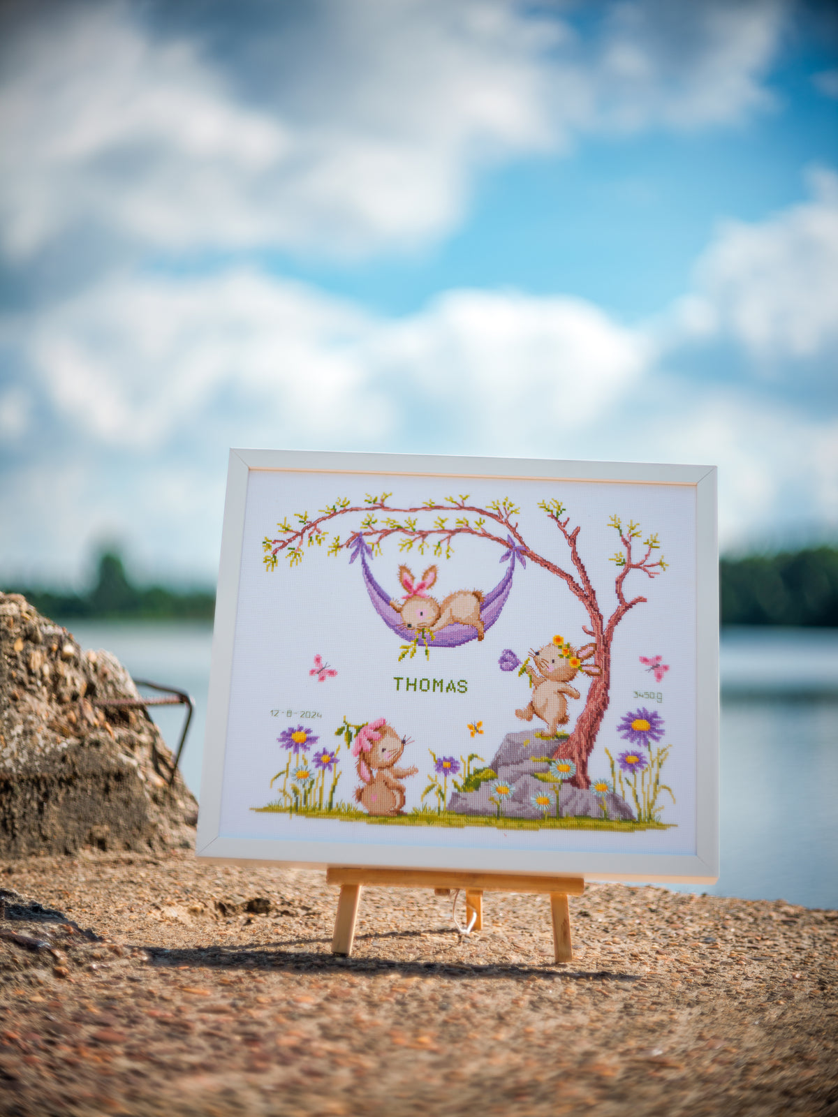 Vervaco Bunnies in the Garden counted cross stitch kit showing the finished design