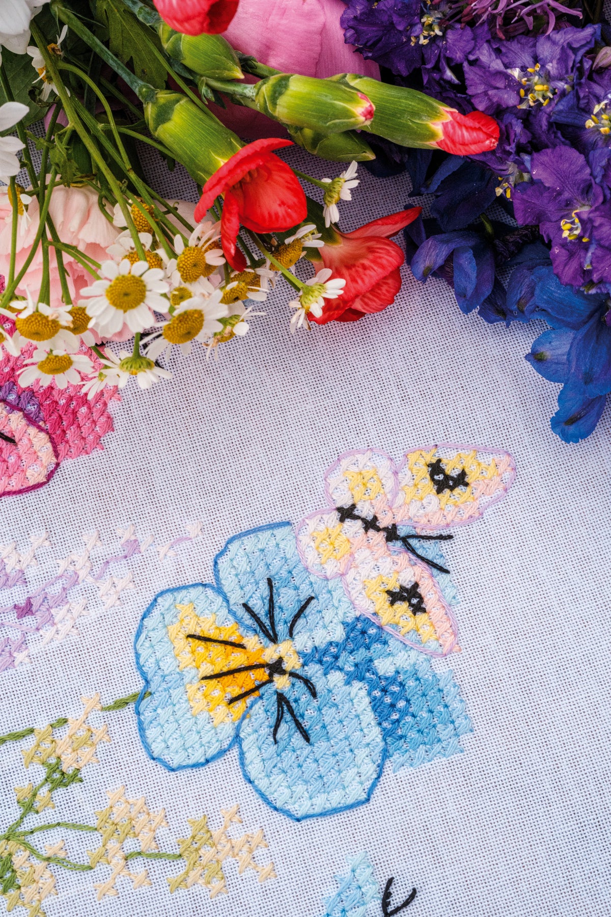 Vervaco Violets embroidered tablecloth kit showing the finished piece
