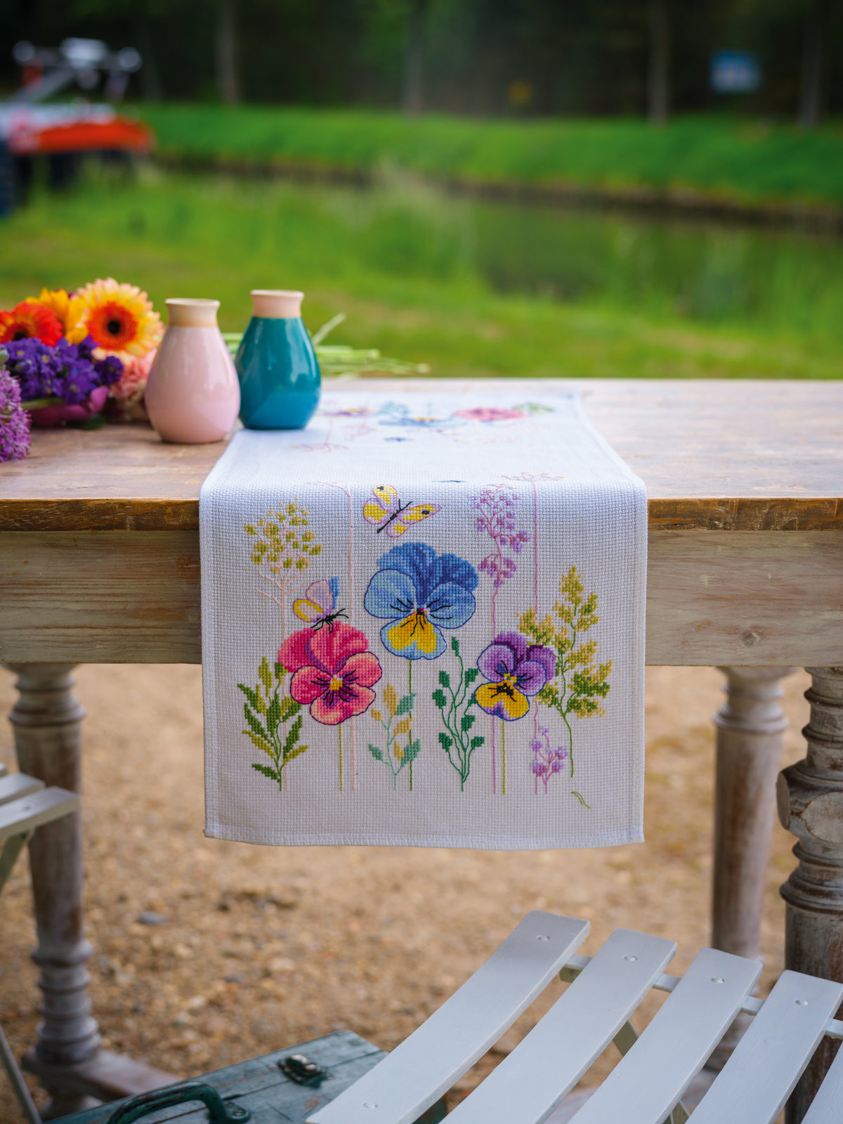 Vervaco Violets Table Runner counted cross stitch kit showing the finished design