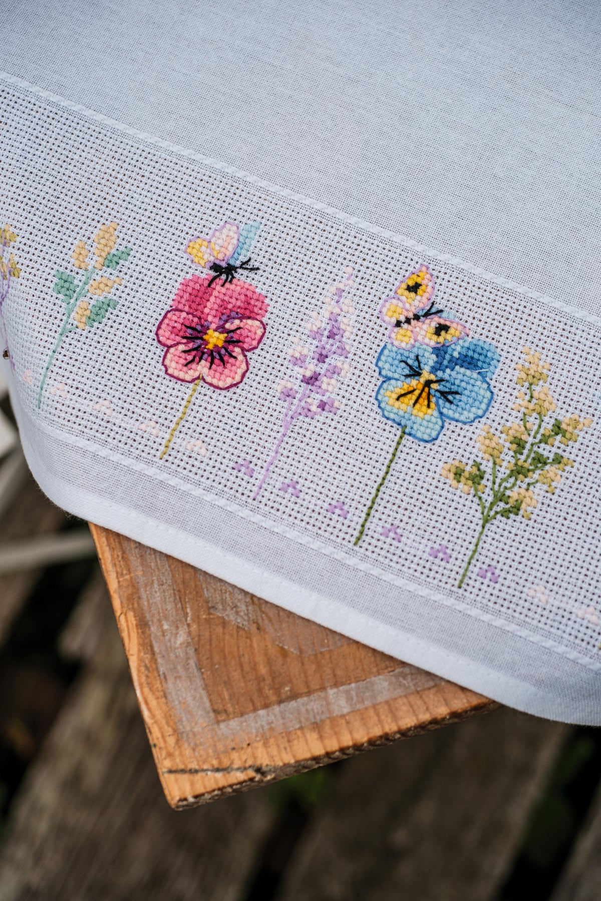 Vervaco Violets Tablecloth counted cross stitch kit showing the finished design