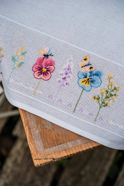 Vervaco Violets Tablecloth counted cross stitch kit showing the finished design