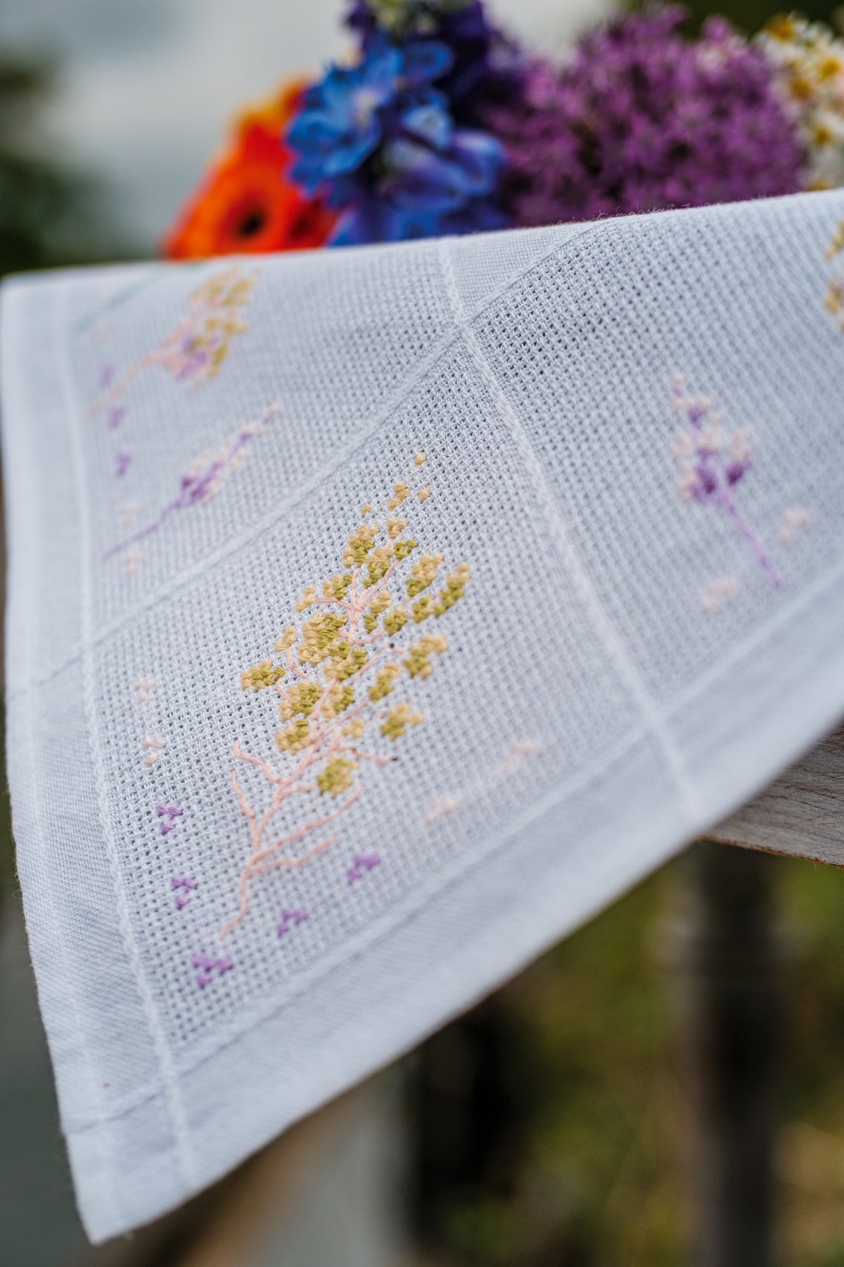 Vervaco Violets Tablecloth counted cross stitch kit showing the finished design
