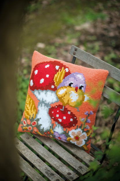 Bird on mushroom cross stitch cushion front