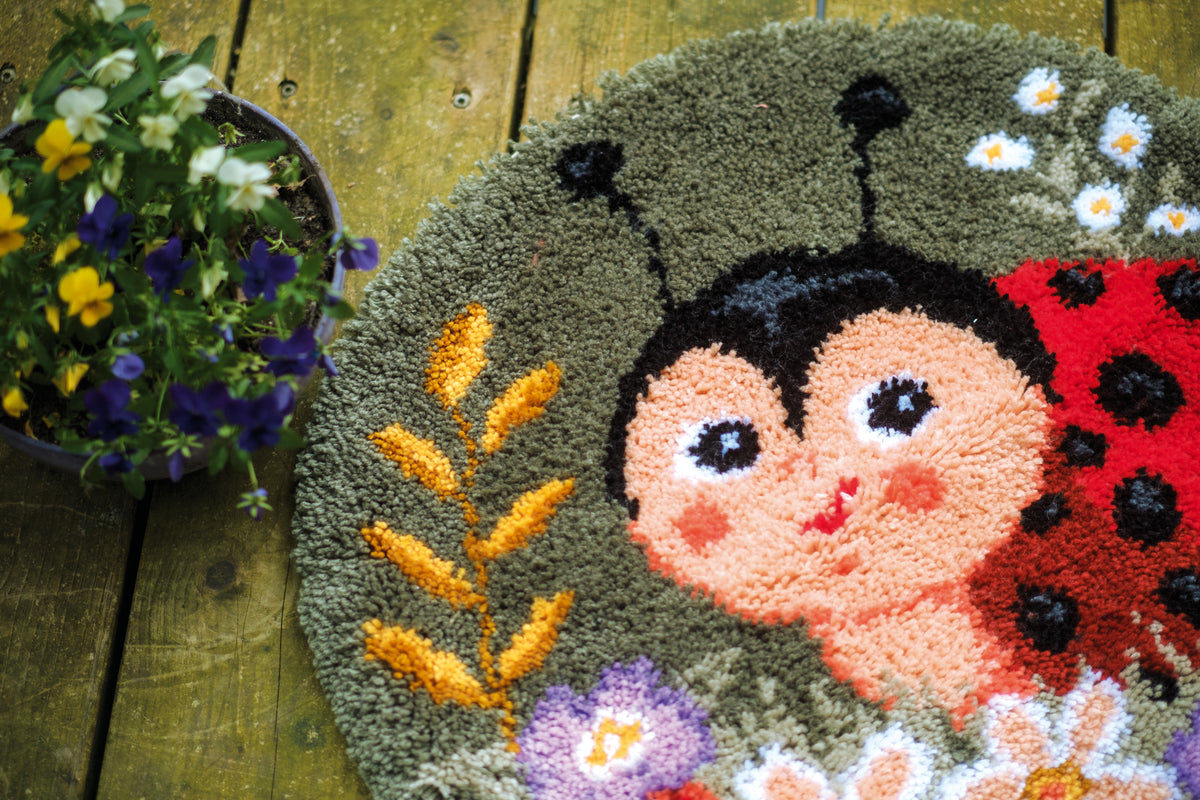 Ladybug shaped latch hook rug