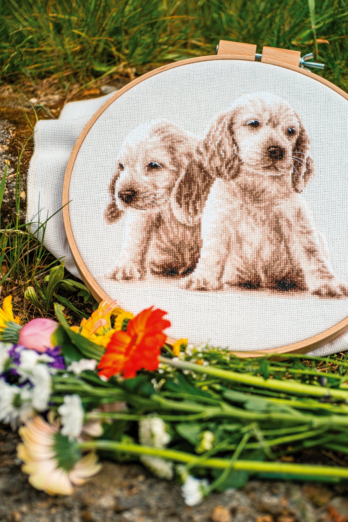 Vervaco Two Puppies counted cross stitch kit showing the finished design