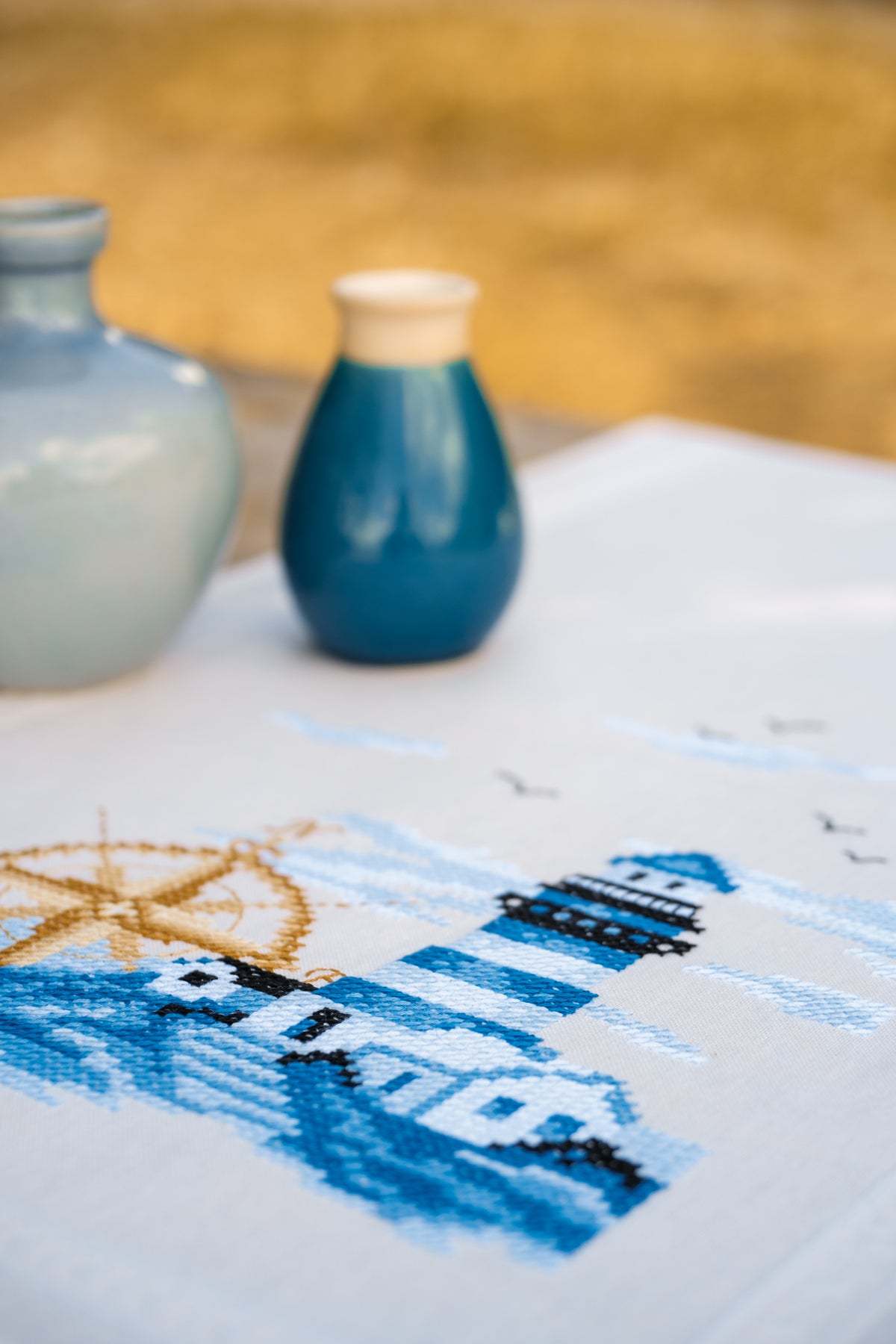 Vervaco Navy embroidered table runner kit showing the finished piece