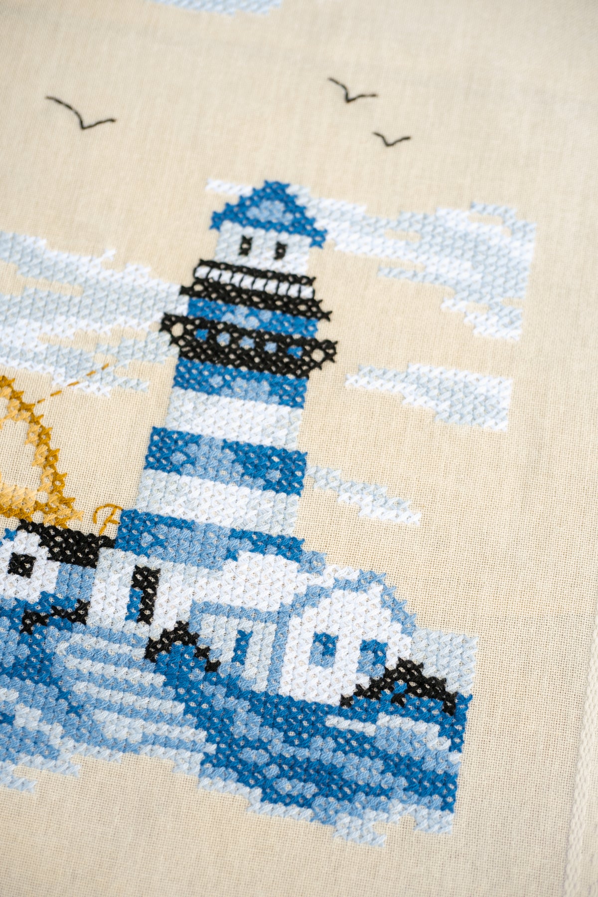 Vervaco Navy embroidered table runner kit showing the finished piece