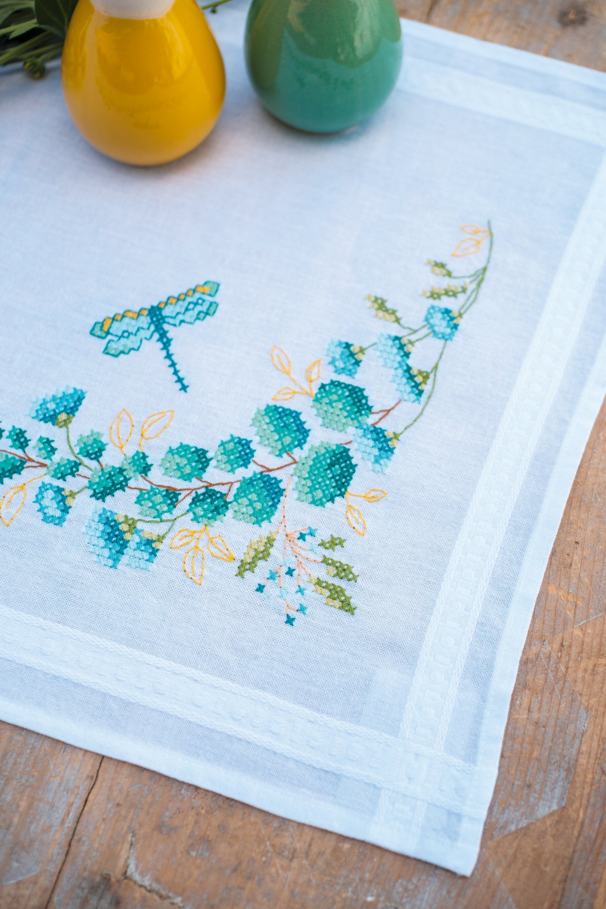 Vervaco Eucalyptus embroidered table runner kit showing the finished piece
