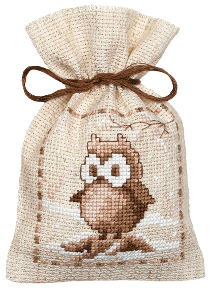 Three natural linen gift bags cross stitched with winter animals