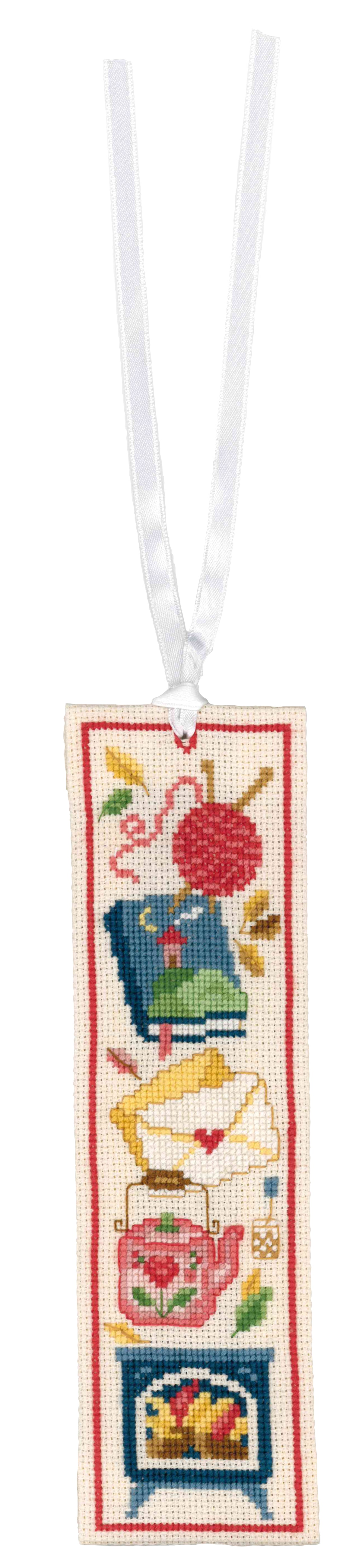 Two cross stitched bookmarks with cosy reading designs