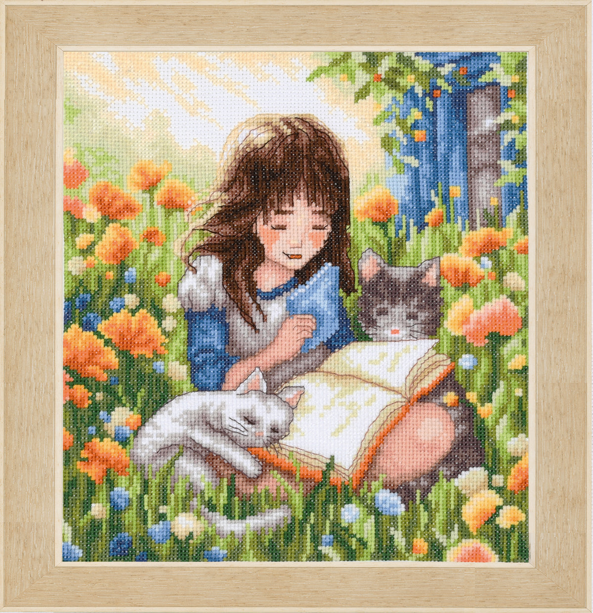 Cross stitch picture of a relaxing garden scene