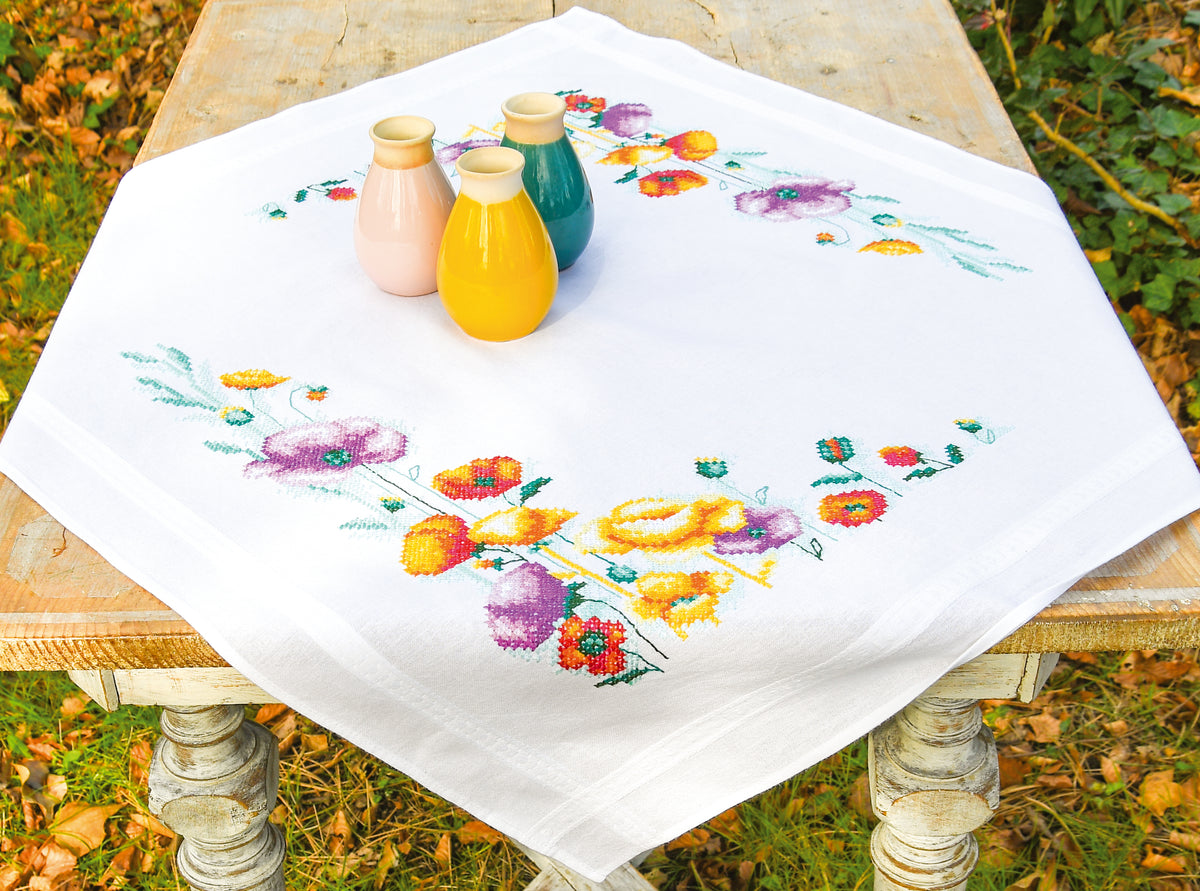 Square white tablecloth embroidered with red poppies