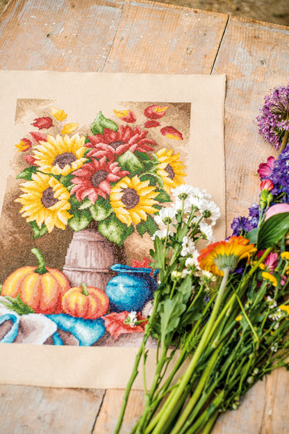 Cross stitch still life of autumn fruit and flowers