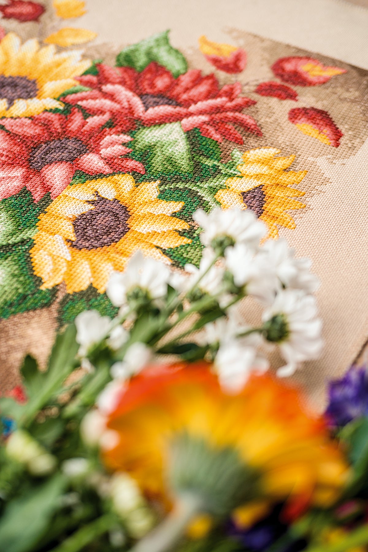 Cross stitch still life of autumn fruit and flowers