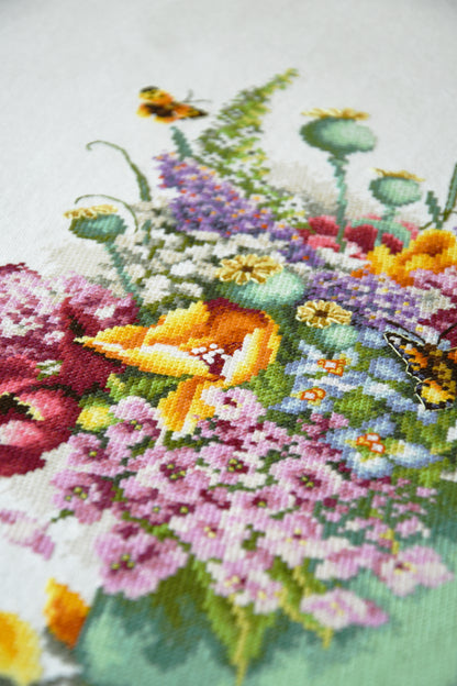 Cross stitch picture of a colourful flower bouquet