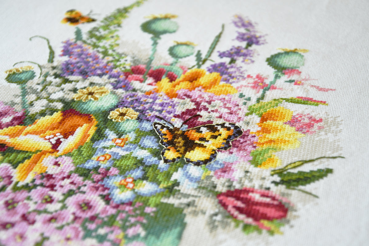 Cross stitch picture of a colourful flower bouquet