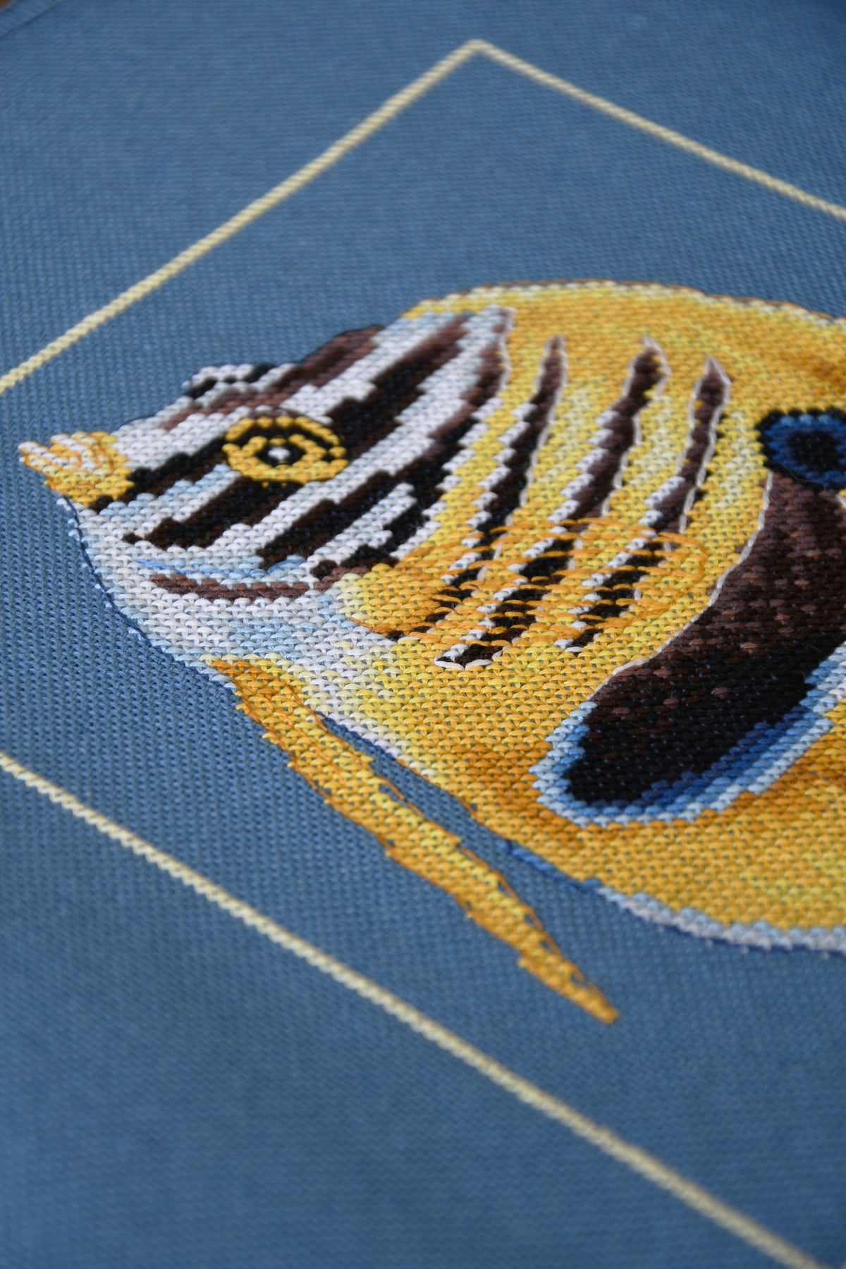 Cross stitch design of a yellow zebra fish