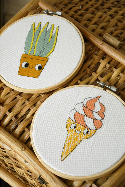 Eva Mouton sansevieria cross stitch design in an embroidery hoop