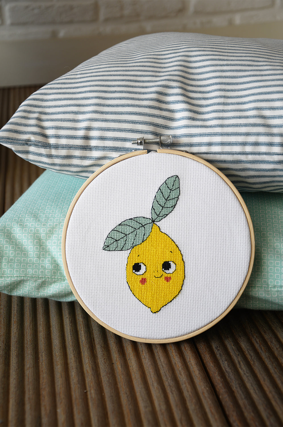 Eva Mouton lemon cross stitch design in an embroidery hoop