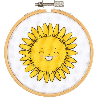 Eva Mouton sunflower cross stitch design in an embroidery hoop