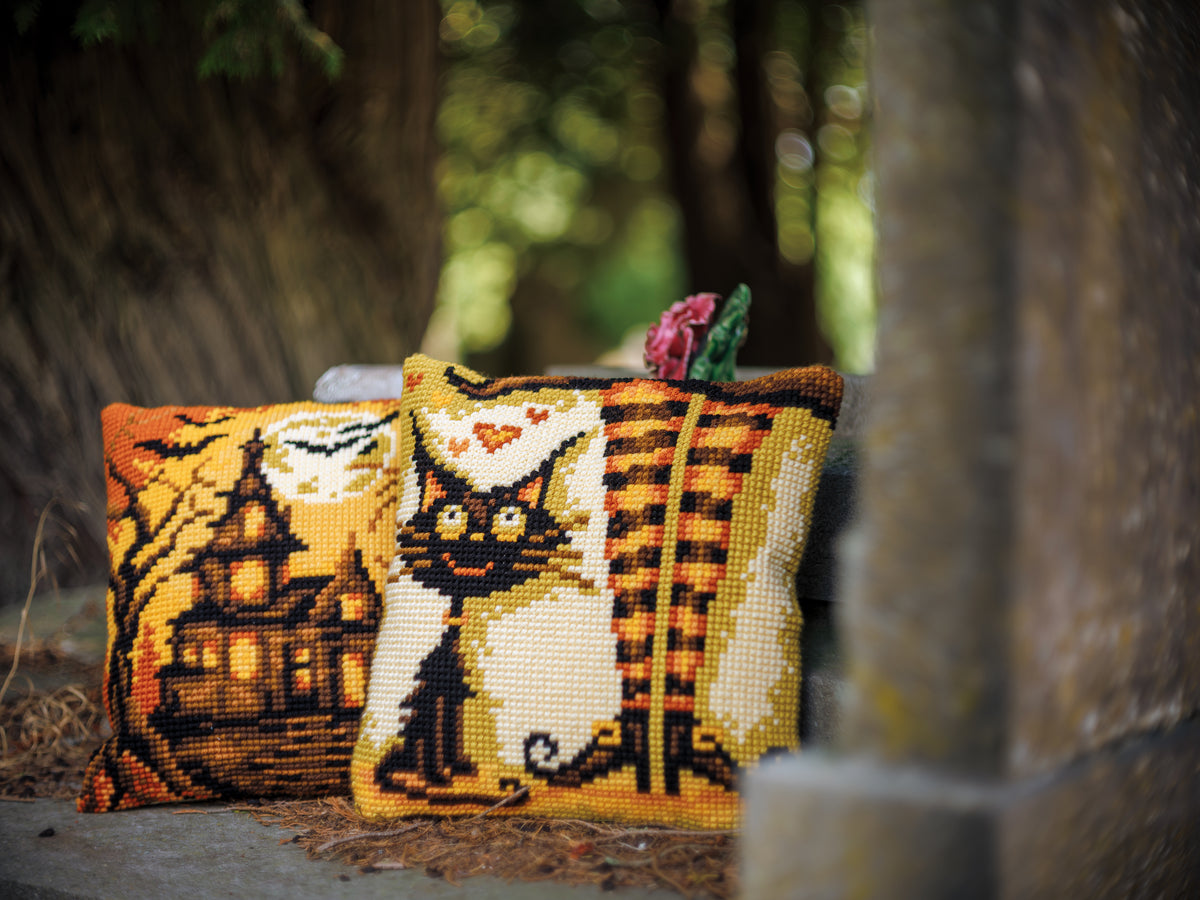Square cross stitch cushion with halloween house design