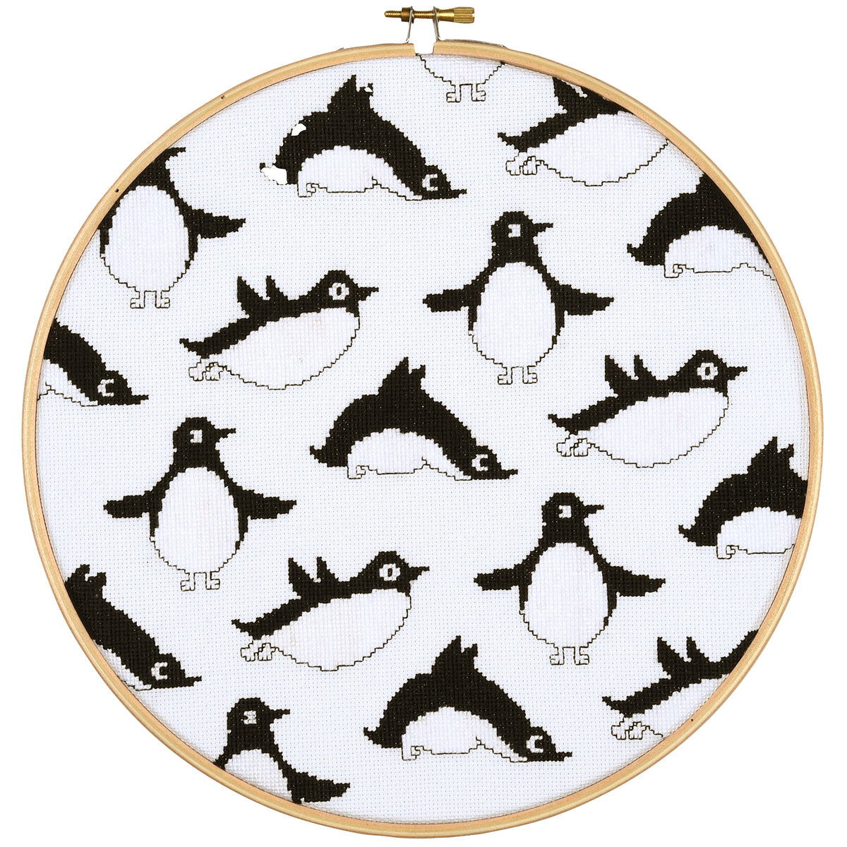 Eva Mouton penguins cross stitch design in an embroidery hoop
