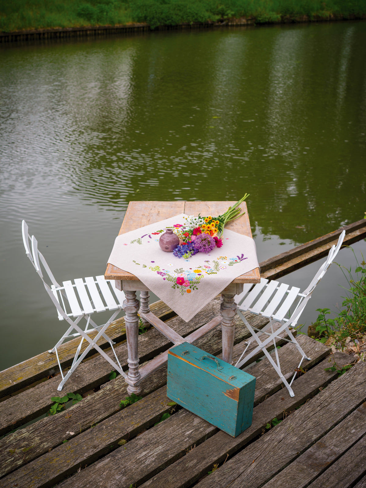 Embroidered tablecloth with cheerful spring floral design