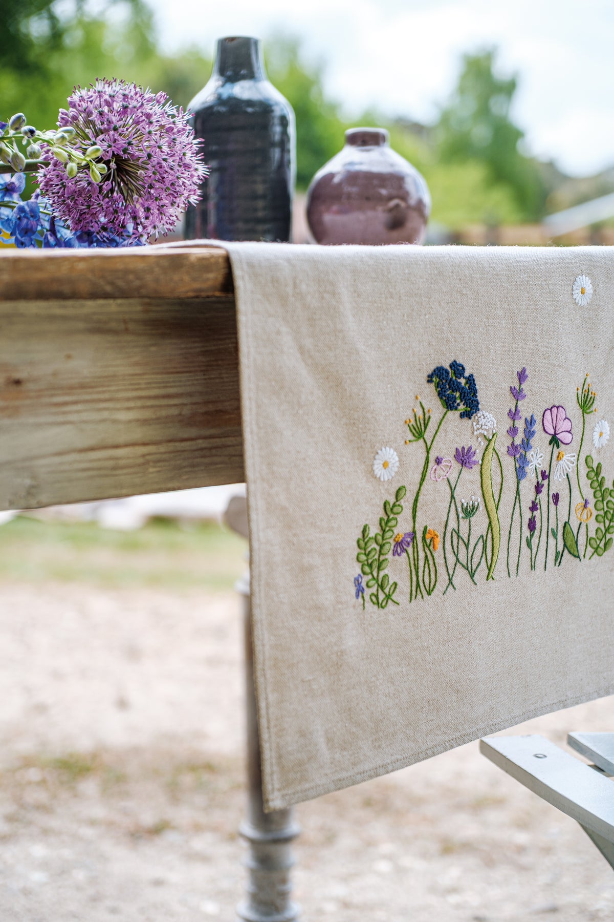 Embroidered table runner with purple garden splendour floral design