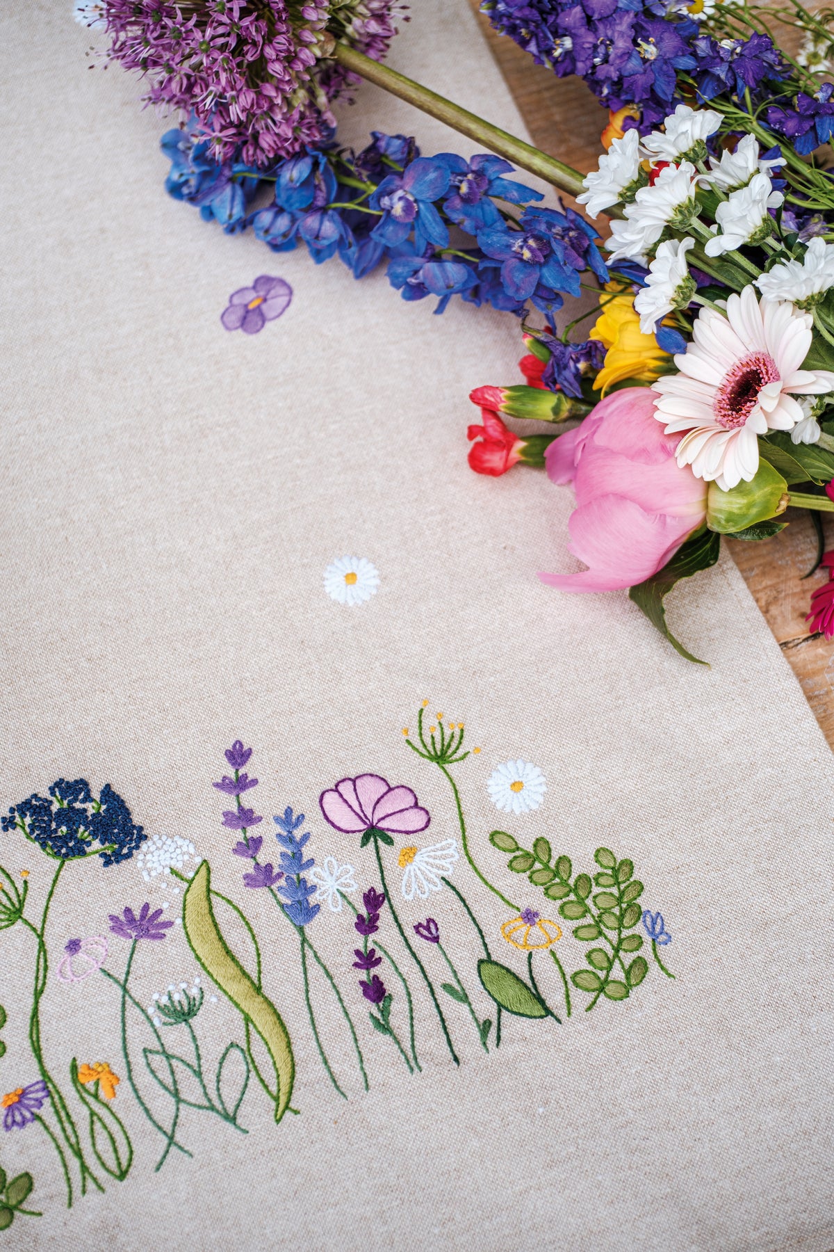 Embroidered table runner with purple garden splendour floral design