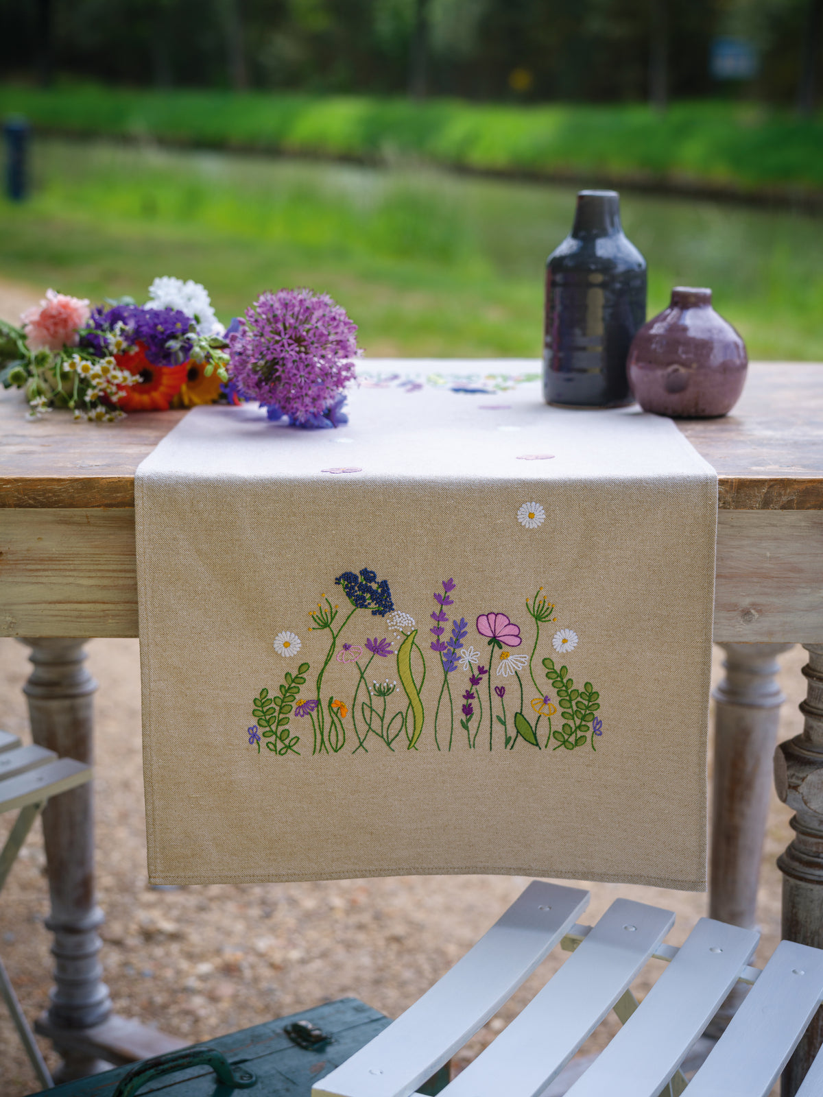 Embroidered table runner with purple garden splendour floral design