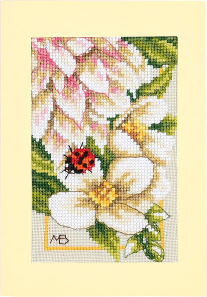 Three cross stitched greetings cards with pink dahlia flowers
