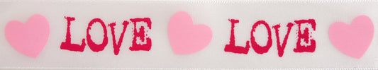 Reel of white ribbon printed with love and hearts in hot pink and baby pink