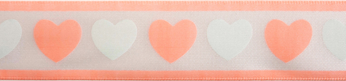 Reel of white ribbon printed with baby pink and green hearts