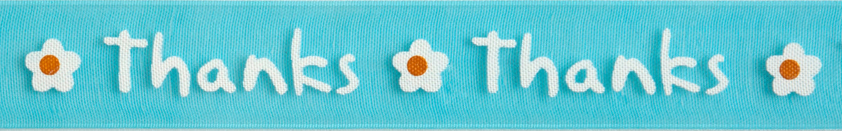 Close-up of thanks print ribbon in yellow & white on blue