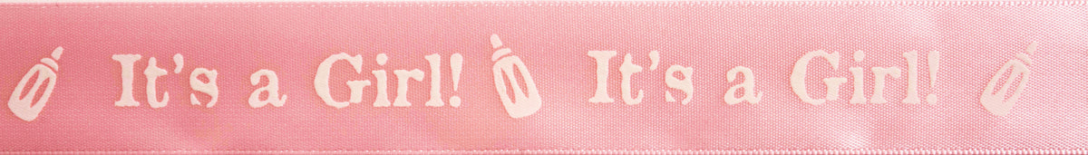 Reel of baby pink satin ribbon printed with It's a Girl in white
