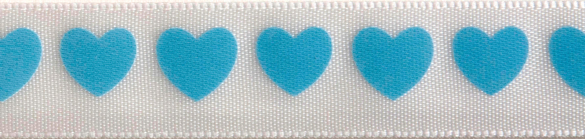 Reel of narrow white satin ribbon printed with baby blue hearts