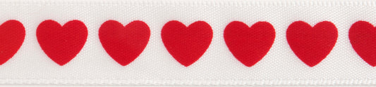 Reel of narrow white satin ribbon printed with red hearts