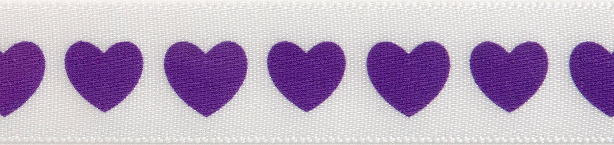 Close-up of satin heart print ribbon in purple on white