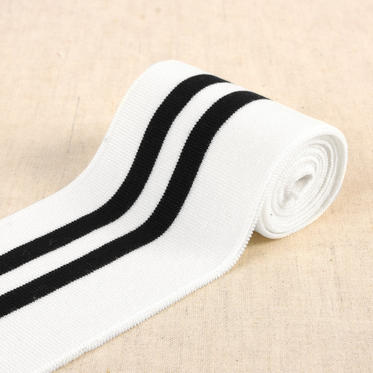 White cuff and waistband elastic with black stripes