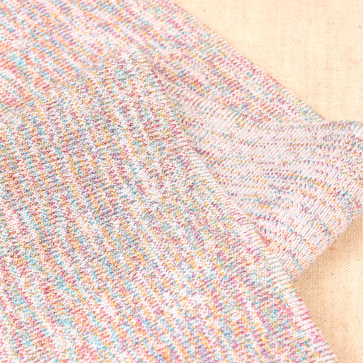 White metallic knit cuff and waistband trim with multicoloured sparkle