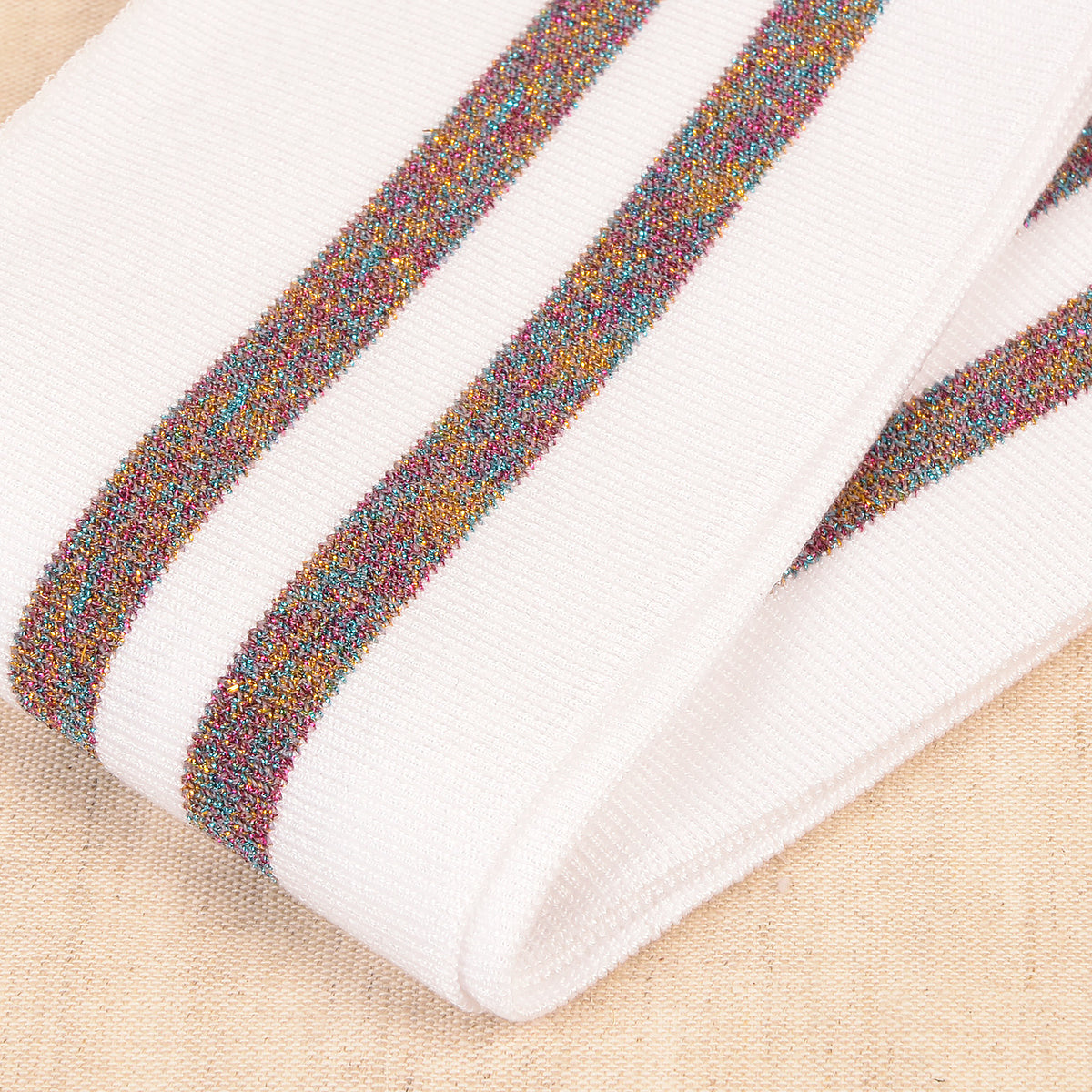 White cuff and waistband trim with multicoloured metallic stripes